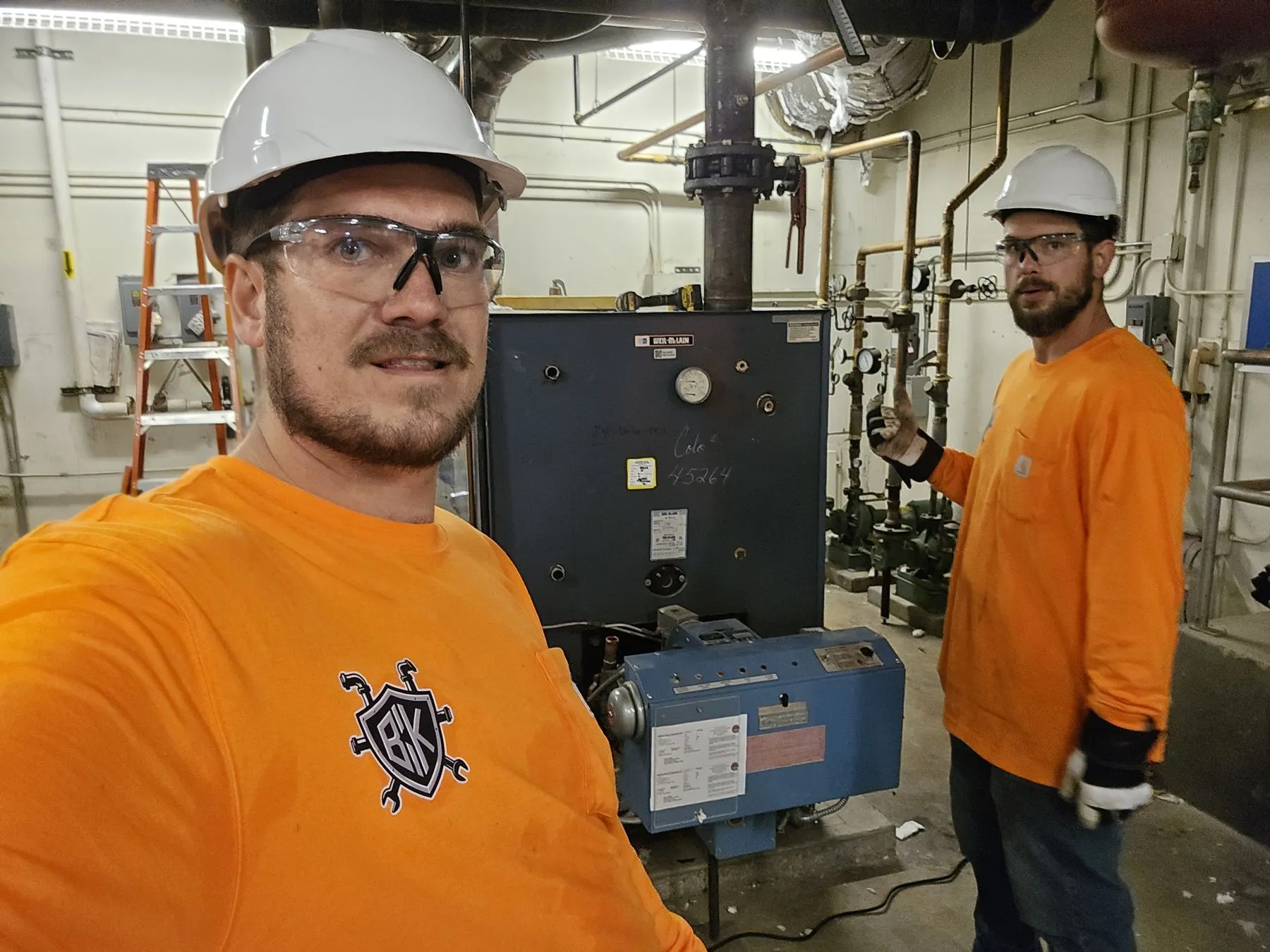 Saber Dean and Gadge Bell in PPE on a school boiler job