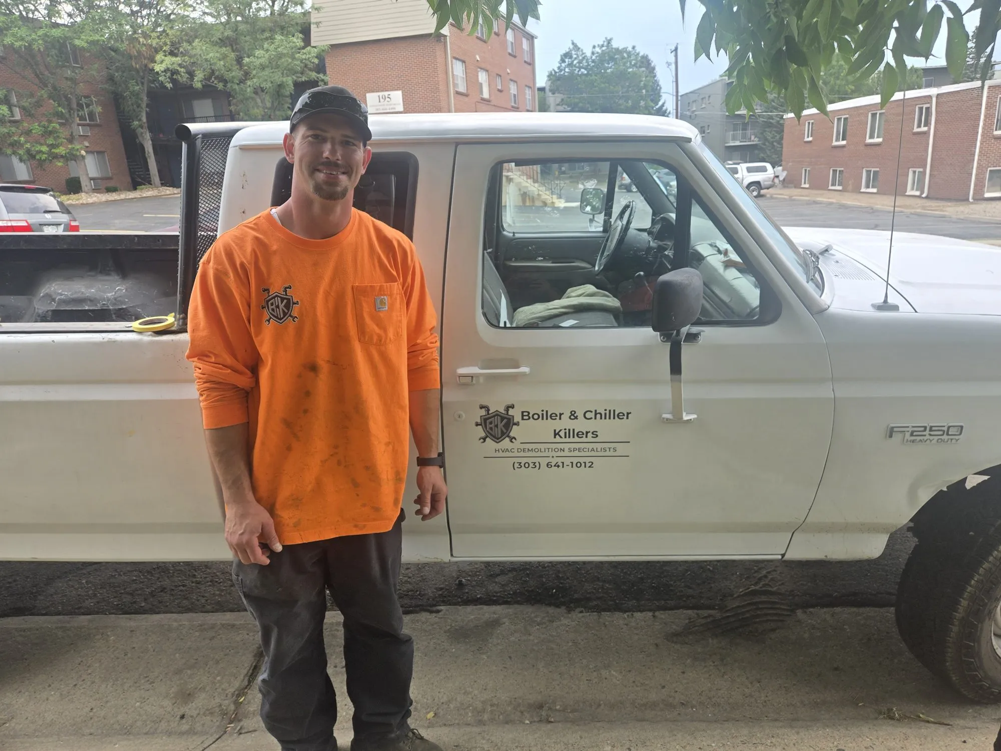 Gadge Bell in front of the BCK work truck